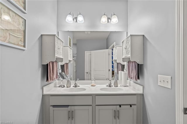 bathroom featuring double vanity and a sink