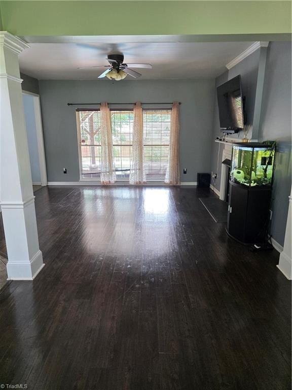 1030 Still Point Dr, Winston-Salem, NC 27103 - unfurnished living room featuring decorative columns, a fireplace, ceiling fan, dark wood-style floors, and baseboards