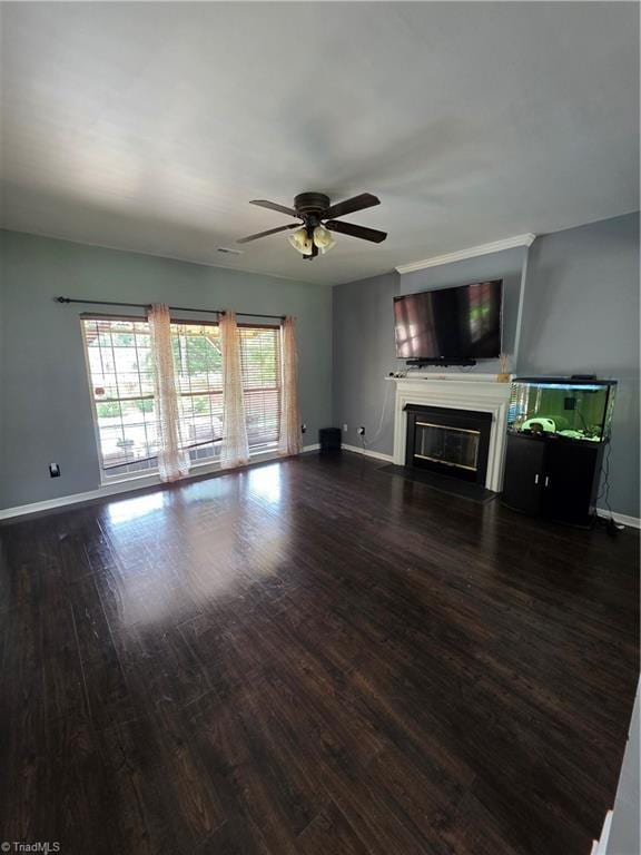 1030 Still Point Dr, Winston-Salem, NC 27103 - unfurnished living room featuring wood finished floors, baseboards, a glass covered fireplace, and ceiling fan