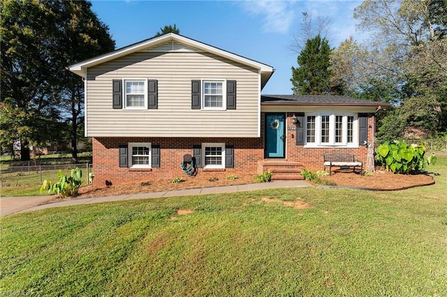 tri-level home featuring a front yard