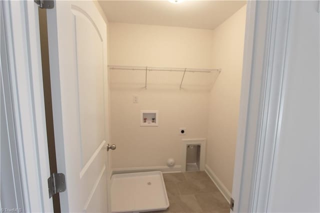 washroom featuring tile floors, hookup for an electric dryer, hookup for a washing machine, and hookup for a gas dryer