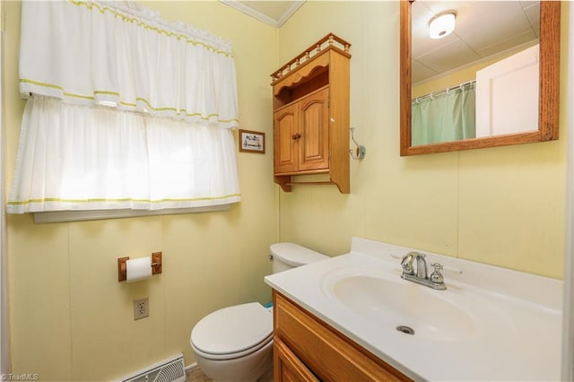 bathroom with vanity, toilet, and ornamental molding