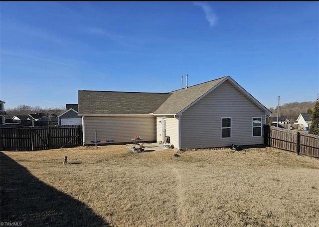 670 Meadowtop Cir, Burlington, NC 27217 - back of house with a fenced backyard and roof with shingles
