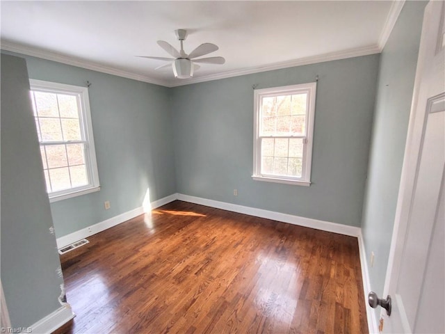 unfurnished room featuring a healthy amount of sunlight, dark wood-type flooring, ceiling fan, and ornamental molding