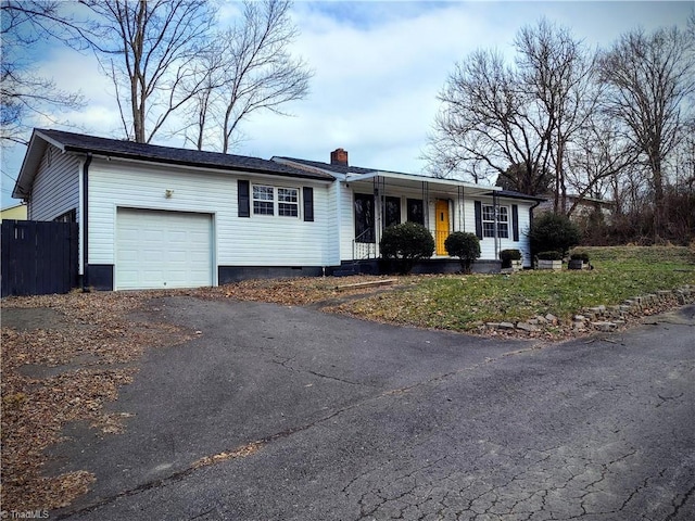 single story home with a garage and covered porch