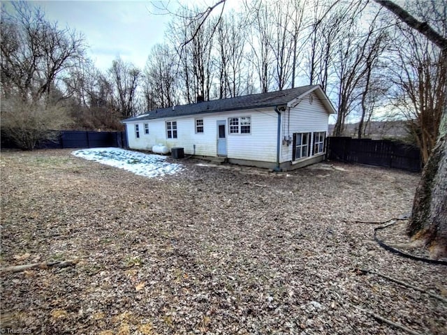 rear view of property featuring central air condition unit