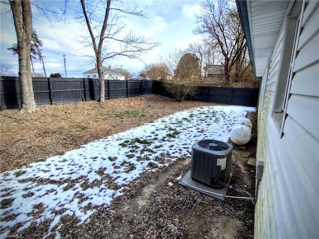 snowy yard with central air condition unit