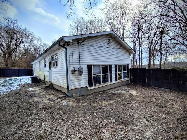 view of side of home with cooling unit