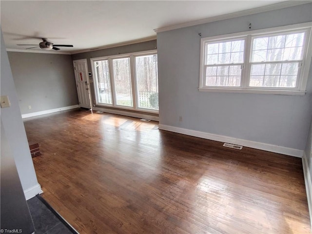 empty room featuring crown molding, ceiling fan, and dark hardwood / wood-style flooring