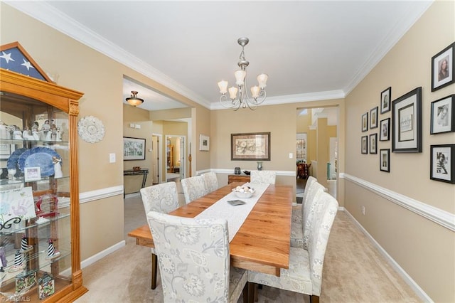 carpeted dining room with crown molding and an inviting chandelier