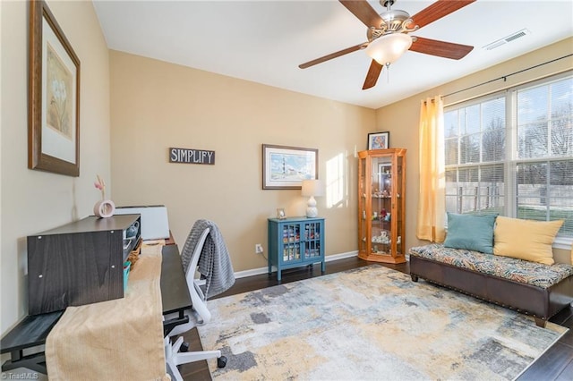 home office featuring ceiling fan and dark hardwood / wood-style flooring