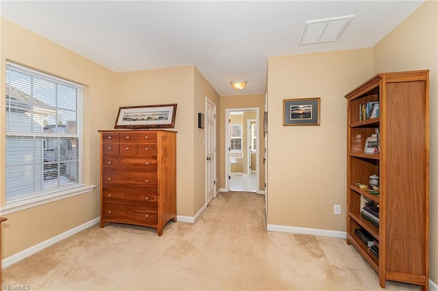 hallway featuring light carpet