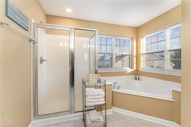 bathroom featuring separate shower and tub and tile patterned floors