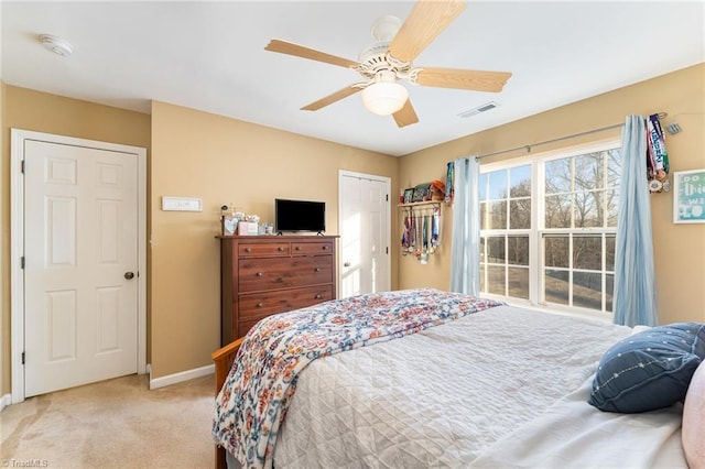 bedroom featuring ceiling fan and light colored carpet