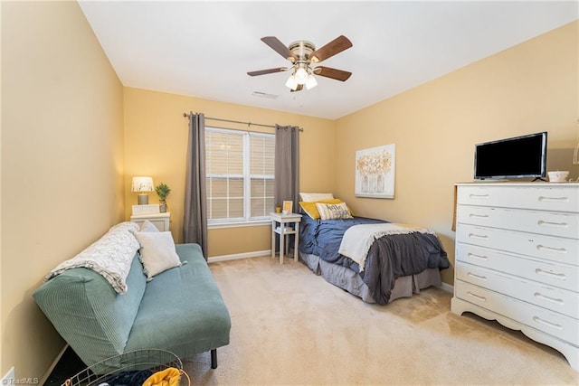 bedroom featuring ceiling fan and light colored carpet