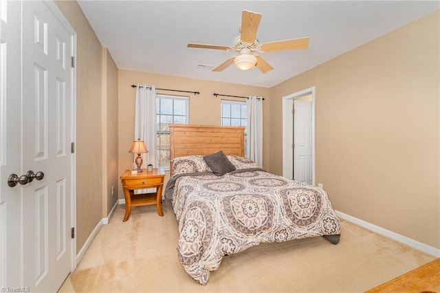 carpeted bedroom featuring ceiling fan