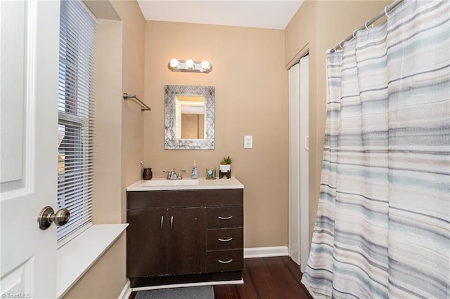 bathroom with wood-type flooring and vanity