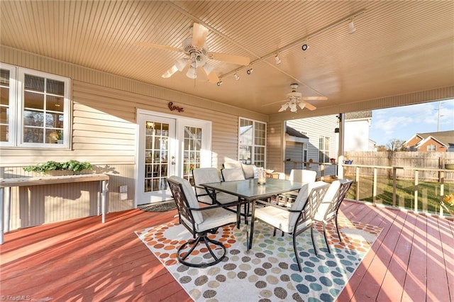 wooden terrace with ceiling fan and french doors