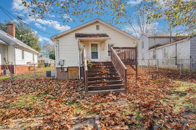 back of house with a deck