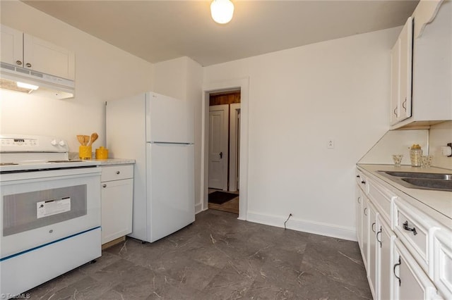 kitchen featuring white appliances, white cabinets, under cabinet range hood, and a sink