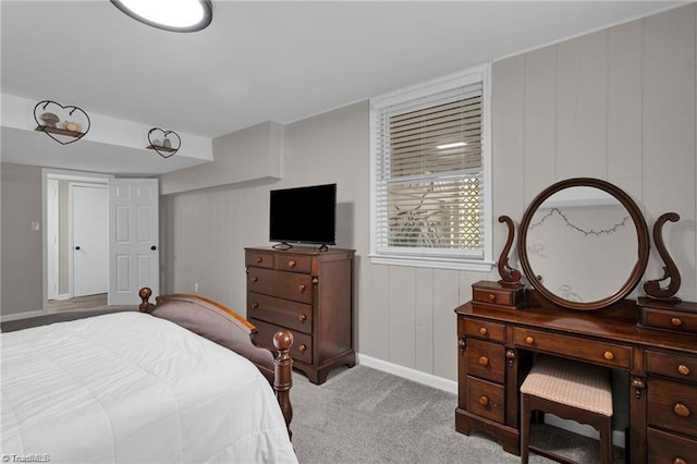 bedroom with carpet flooring and baseboards