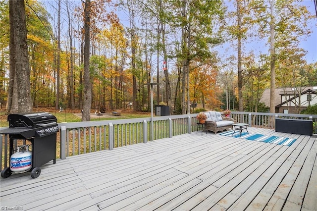 wooden deck with an outdoor structure and a shed