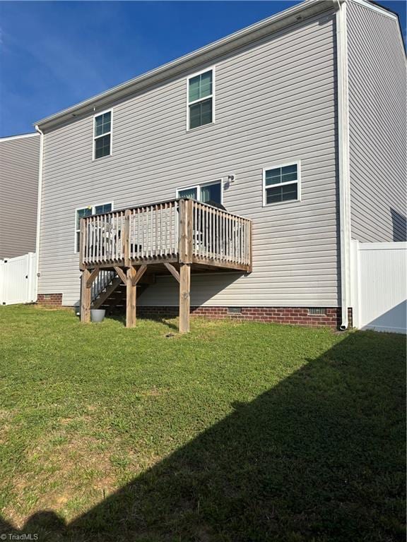 6849 Keeneland Dr, Whitsett, NC 27377 - rear view of property with crawl space and a deck