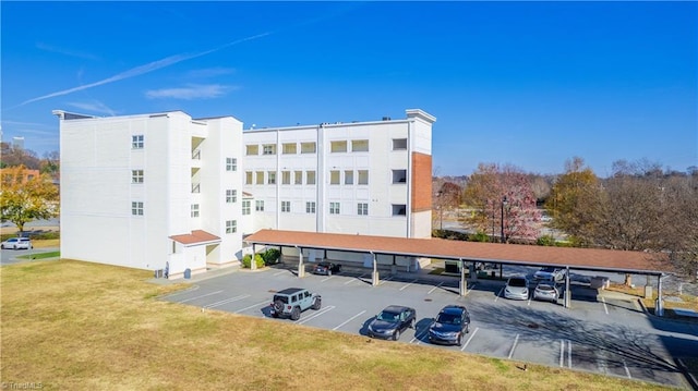 view of property featuring uncovered parking