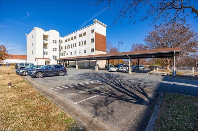 view of partially covered parking lot