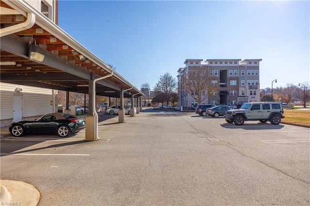 view of partially covered parking lot