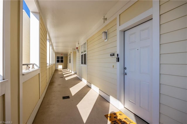 view of exterior entry with covered porch