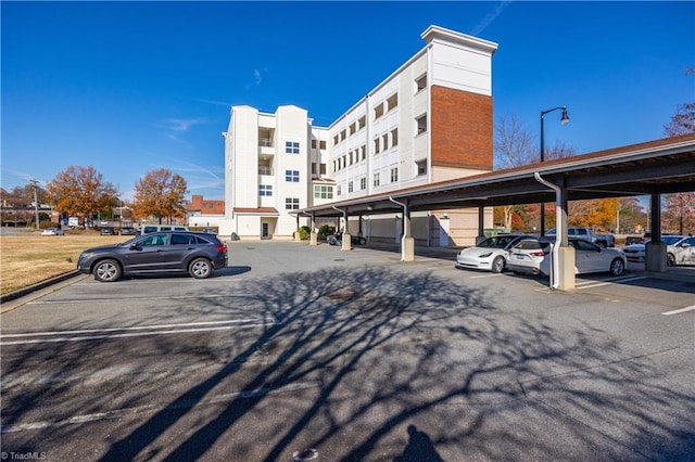 view of partially covered parking lot