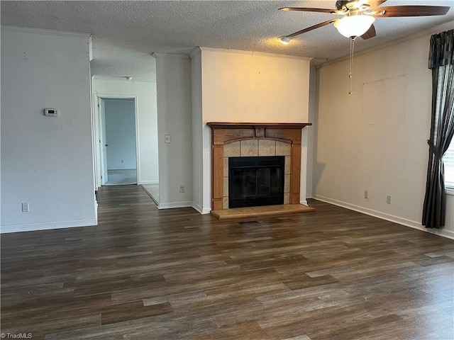 unfurnished living room with a tile fireplace, hardwood / wood-style flooring, and ceiling fan