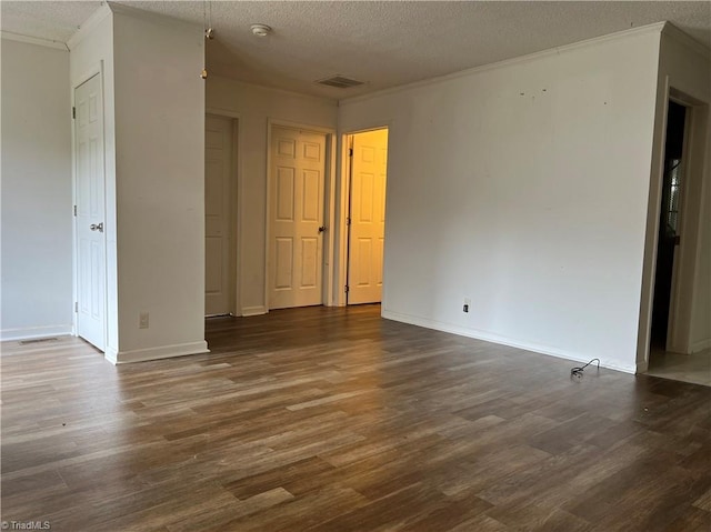 unfurnished room featuring wood-type flooring and a textured ceiling