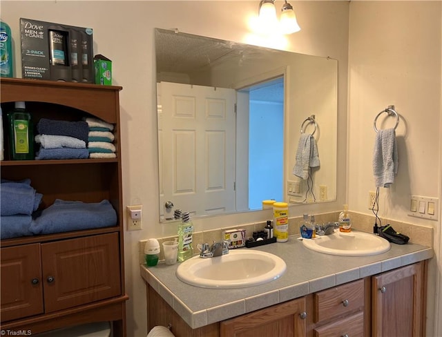 bathroom featuring double vanity