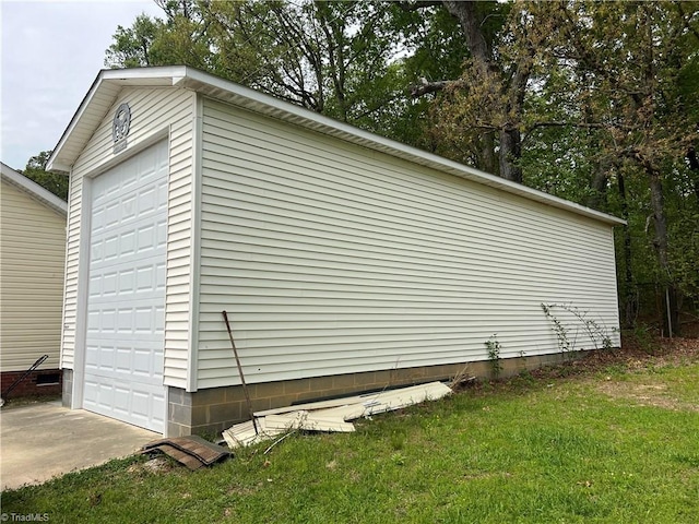 view of home's exterior with a garage and a yard