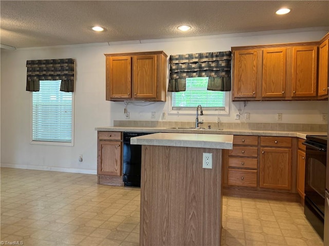 kitchen featuring light tile patterned flooring, sink, black dishwasher, range with electric stovetop, and a textured ceiling