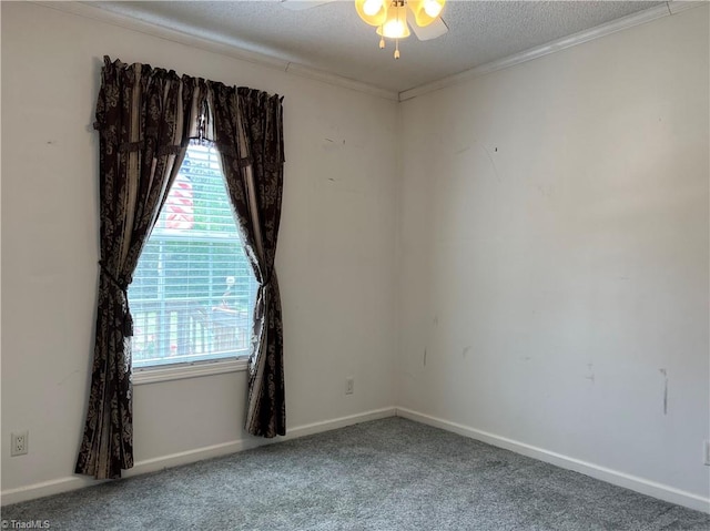 empty room with a textured ceiling, carpet, and ceiling fan