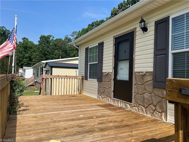 wooden deck with an outdoor structure