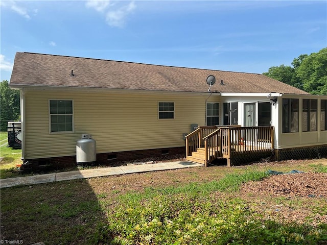 back of house featuring a deck