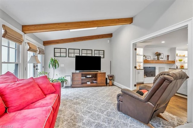 living room featuring lofted ceiling with beams and hardwood / wood-style floors