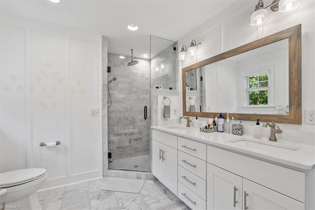 bathroom featuring vanity, toilet, and an enclosed shower