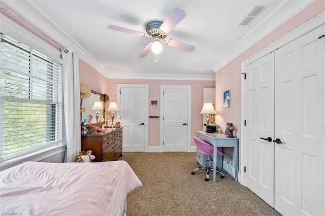 bedroom featuring multiple windows, light colored carpet, crown molding, and ceiling fan