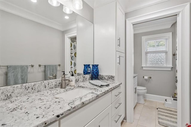 bathroom featuring vanity, toilet, ornamental molding, and tile patterned flooring