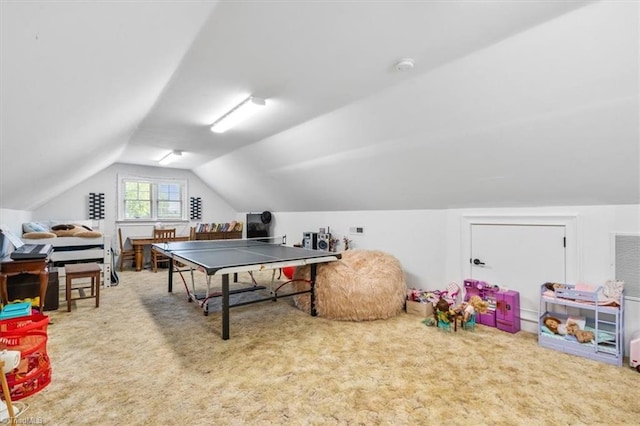 rec room featuring carpet floors and vaulted ceiling