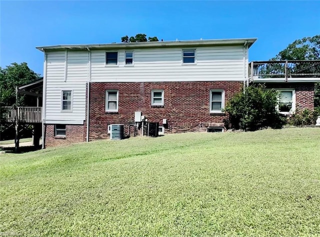 back of house with a lawn