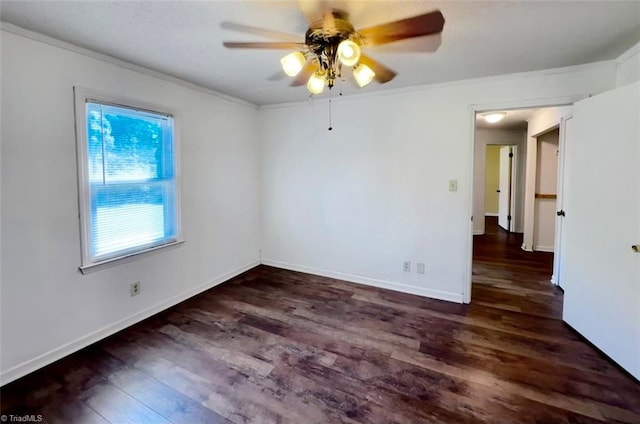 spare room with ceiling fan, dark hardwood / wood-style floors, and crown molding