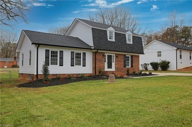 front facade featuring a front yard