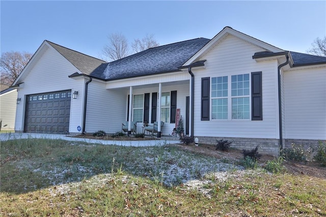 view of front of house featuring a porch and a garage