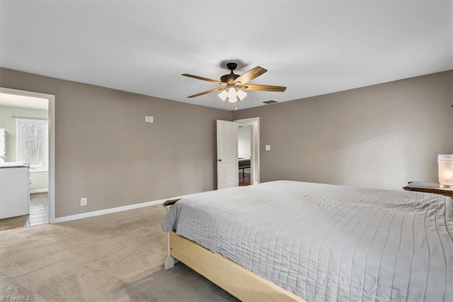 bedroom featuring carpet floors, visible vents, baseboards, and ceiling fan